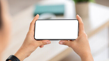 Smartphone with white blank screen in woman hands
