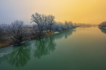 Beautiful winter sunrise on Siret river - 729337513