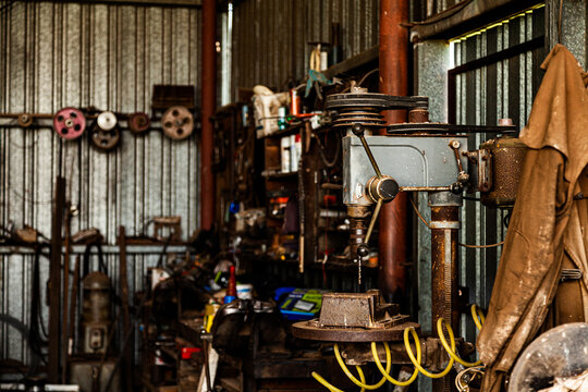 Old shed on farm full of tools and equipment