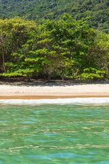 View of Dois Rios beach during a beautiful sunny day, located in Ilha Grande, Angra dos Reis, Rio de Janeiro, Brazil.
