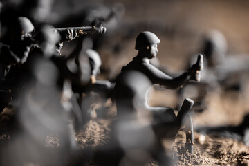 Fototapeta na wymiar Toy Soldiers On The Battlefield Of War