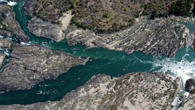 A little part of the famous Khon Phapheng Falls from above, the colours of the water in between the rocks and trees make a very special sight from above.