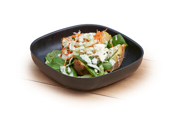 Bowl with hot patatoes, salad and Cheese on white and wood