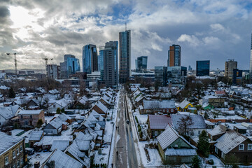 Aerial winter view of snowy Vilnius city center, down town, Šnipiškės district, Lithuania - obrazy, fototapety, plakaty
