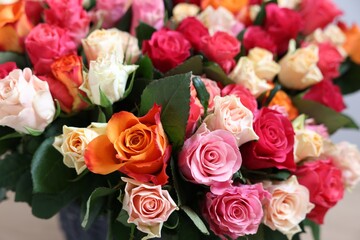 Bouquet of beautiful roses on light background, closeup