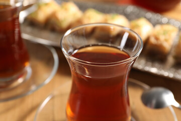 Traditional Turkish tea in glasses on table, closeup