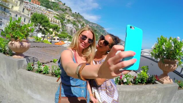 Women, selfie and together in Italy, outdoor and architecture of buildings, smile and happiness. Tourists, comic and crazy as funny, relaxing and environment, blog and social network for connection
