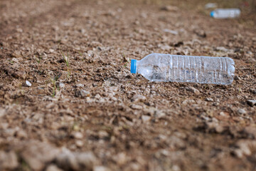 Concept of environmental pollution. Picture of trash on the beach environmental pollution Garbage and plastic bottles on the beach left behind by tourists.