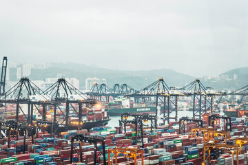 Harbor of Hong Kong with many shipping containers.