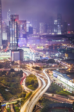 Urban views of Hong Kong at night with colorful signs and large sky scrapers. Hong Kong