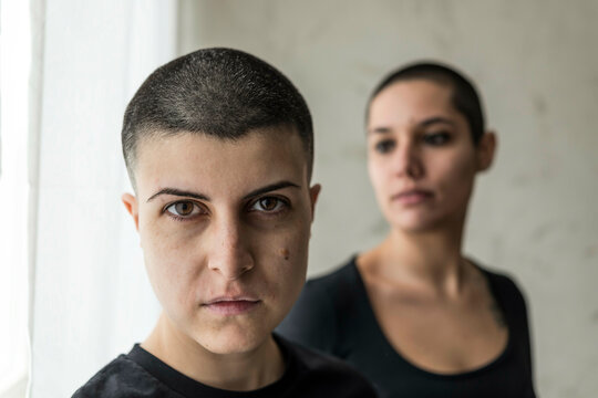 Tattooed women indoors, Milano, Italy.