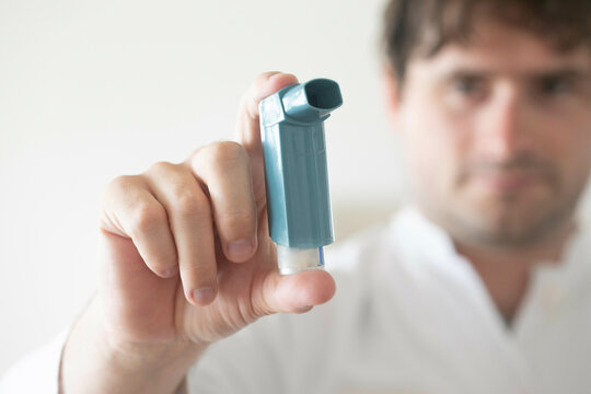 doctor male holding an asthma spray in hishand