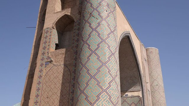 Tall minarets with historic intricate tiling of a madrassa in Samarkand, Uzbekistan along the historic Silk Road