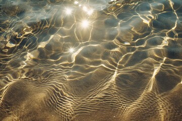 Sun lights shadow in wavy water on abstract sand background - obrazy, fototapety, plakaty
