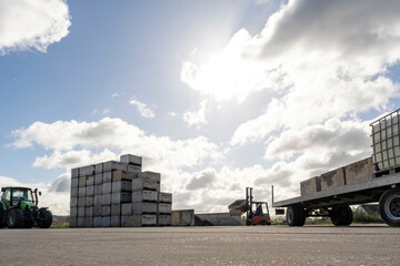 landscape of a farm depot storing crates for the harvest