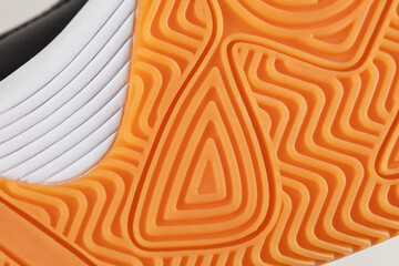 Part of a polyurethane shoe sole on a white background.