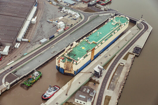 Aerial image of transport ship in port being readied to depart. Bremerhaven, Germany