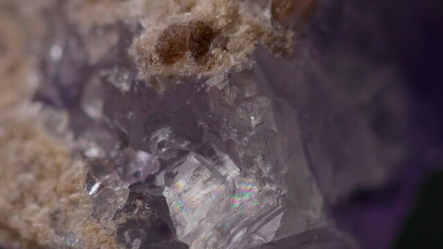 Close up of natural purple fluorite stone texture rotating 