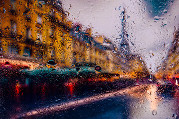 View through glass covered with raindrops to morning Paris in the fog, focus on raindrops	 - Powered by Adobe