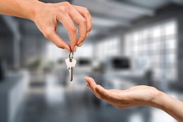 Officer gives keys from the house to client, real estate