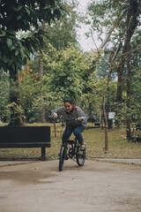Obraz premium Happy Asian young woman walk and ride bicycle in park, street city her smiling using bike of transportation, ECO friendly, People lifestyle concept.