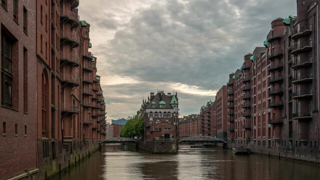 Hamburg Germany time lapse, day to night city skyline at Speicherstadt and canal