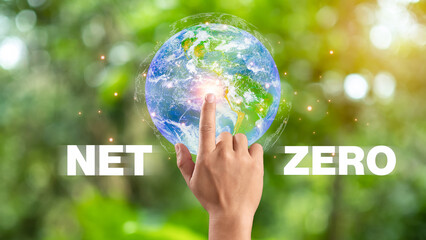 Hand of human pointing to earth and Net Zero icon, carbon neutral and net zero concept for net zero...