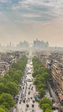 Paris France time lapse, city skyline at La Defense business district (Vertical)