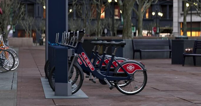 3D animation of generic Electric bicycle charging station. Shared electric bikes parked for rent on city street