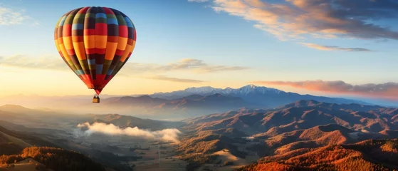 Crédence de cuisine en verre imprimé Ballon Hot air balloon in the blue sky over the mountains.
