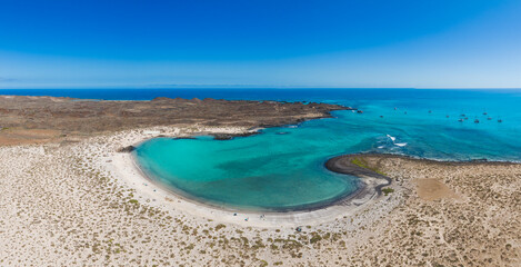 Aerial panoramic landscape view of the beautiful secluded tropical looking natural bay and the island Isla de Lobos near Corralejo, Fuerteventura,  Canary Islands, Spain