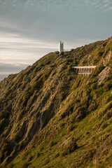 road to lighthouse on the hill coast