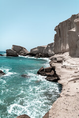 Fototapeta na wymiar rocks cliff in the turquoise sea