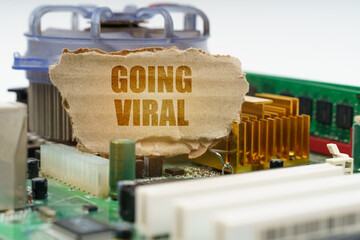 On the computer motherboard there is a cardboard with the inscription - Going viral