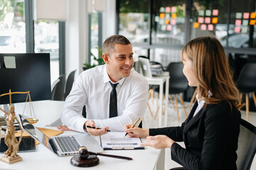 business people and lawyers discussing contract papers sitting at the table. Concepts of law, advice, legal services.