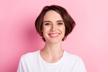 Photo portrait of woman with bob hairstyle smiling overjoyed isolated on pastel pink color background