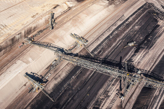 Aerial views huge mining machinery in huge brown coal strip mine. Welzow, Germany