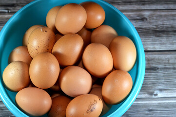 organic brown fresh and raw hen chicken eggs, stack of eggs ready to be cooked in various cuisines,...
