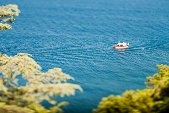 Elevated perspective of fishing boat in water.