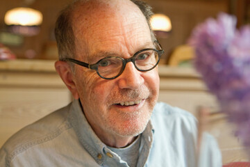 Portrait of older man while in a restaurant
