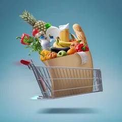 Fototapeten Fast flying shopping cart delivering groceries © stokkete
