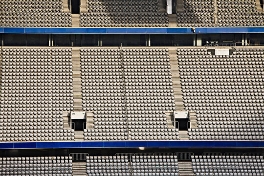 Rows of empty stadium seats.