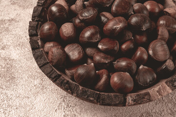 fresh chestnuts, in a wooden bowl, top view, no people,