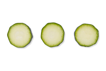 Top view of three slices of zucchini vegetable on a cutout PNG transparent background