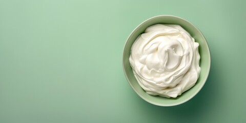 Creamy Quark Or Cream In A Bowl On A Green Background With Space For Text. Сoncept Yummy Quark, Creamy Delights, Green Background, Space For Text, Food Photography