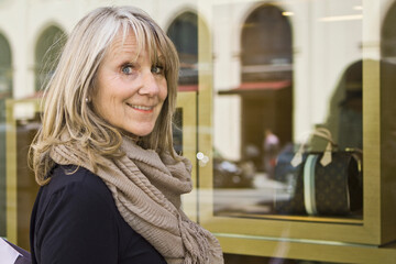 Portrait of an older woman shopping in downtown Munich. Munich, Germany 