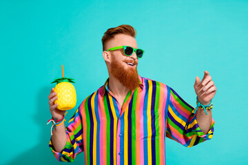 Photo of funky guy with lemonade pineapple cup with straw dancing relaxed at exotic vacation...