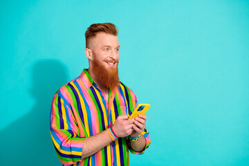 Photo of businessman has idea for next startup in ecommerce nft collection using phone look empty space isolated on blue color background