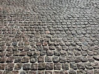 cobblestone stone pavement street background.