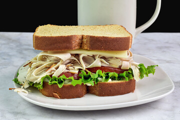 toasted chicken sandwich  top with swiss cheese